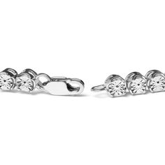 Indulge in the luxurious sparkle of diamonds with this breathtaking sterling silver tennis bracelet. Expertly crafted from .925 sterling silver, this bracelet showcases 10 natural round cut diamonds in a brilliant miracle setting. The diamonds boast a warm I-J color and a clarity of I2-I3, creating a stunning contrast against the gleaming silver band. The 7.25-inch bracelet features a secure box clasp, making it a comfortable and practical accessory for everyday wear. Perfect for elevating your Silver Tennis Bracelet, Bracelet Tennis, Fine Ring, Diamond Tennis Bracelet, Box Clasp, Bridal Bands, Tennis Bracelet Diamond, Bracelet Collection, Fine Earrings