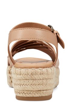 Slender straps cross over a wide counterpart on this cushioned sandal set atop a jute-wrapped platform. 1 3/4" heel; 1 1/4" platform Adjustable ankle strap with buckle closure Cushioned footbed Leather upper/synthetic lining and sole Imported Spring Adjustable Cross Strap Slingback Sandals, Synthetic Sandals With Adjustable Cross Strap, Spring Crossover Sandals With Heel Strap, Beige Strappy Platform Sandals, Spring Cross Strap Footbed Sandals With Adjustable Strap, Beach Sandals With Adjustable Cross Strap, Spring Synthetic Sandals With Crossover Design, Synthetic Crossover Sandals For Spring, Casual Natural Sandals With Heel Strap