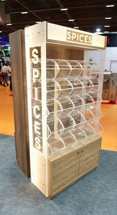 a display case for spices on the floor