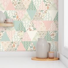 the wallpaper in this kitchen is colorful and has geometric designs on it, as well as vases