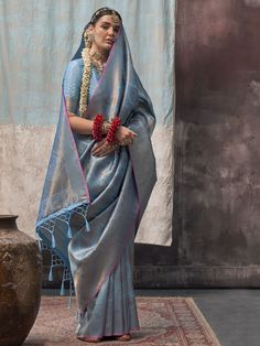 Elevate your traditional attire with this alluring sky-blue silk saree with zari weaving work, perfect for weddings, festivals, and special occasions. The intricate zari weaving adds a touch of elegance and sophistication, making you stand out in the crowd. The matching silk blouse features the same zari detailing, completing the look seamlessly.
The 5.50-meter saree and unstitched blouse material give you the freedom to customize the fit according to your preference. The sky-blue color exudes c Golden Saree, Blue Silk Saree, Grey Saree, Lehenga Choli Wedding, Floral Lehenga, Purple Saree, Orange Saree, White Saree, Traditional Saree