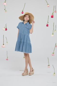 Product Description Introducing the Casual Short Sleeve Button Down Distressed Hem Flowy Tiered Babydoll Denim Shirt Dress with Pockets—an essential addition to your casual wardrobe that combines style and comfort. Made from high-quality, medium-washed cotton, this denim dress is naturally breathable and soft to the touch. The design features a lapel collar, functional buttons, and pockets, coupled with a high waistline and a subtle high-low hemline that enhance its stylish aesthetic. The babydoll silhouette is flattering for any body shape, making this piece as comfortable as it is fashionable. Details Material: Premium quality medium-washed cotton, breathable with no stretch. Care Instructions: Hand wash cold, hang dry, do not bleach, low iron if needed. Sizes Available: S, M, L, XL, XXL