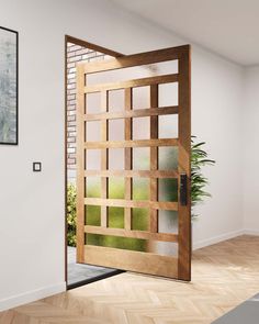 an open wooden door in a white room