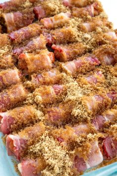 a casserole dish filled with meat and crumbs on top of it