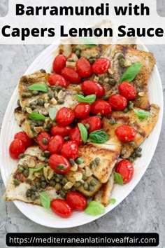 a white plate topped with fish covered in capers and tomatoes