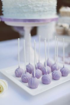 there are many cake pops on the plate