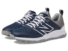 the new balance 997 running shoe in navy and grey