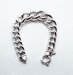 Brand: Argentidea Jewelry Instagram: https://www.instagram.com/gioielli_argentidea/ Measurement: 20.5 cm Weight: 47g. Silver colour Eye-catching women's bracelet, in 925 silver, grumetta chain with graduated links. The bracelet is a gradual lump link chain, the central measurement has a width of 20 mm up to the final links which have a width of 12 mm. The bracelet features a spring ring clasp with two micro-cast ends for a better finish. The bracelet is the natural color of silver, manually poli Modern Chunky Silver Jewelry, Modern Chunky Bracelets As Gift, Modern Chunky Silver Bracelet, Modern Chunky Bracelet For Gift, Chunky Sterling Silver Bracelet As Gift, Chunky Sterling Silver Bracelets As Gift, Chunky Silver Bracelet Jewelry, Elegant Chunky Silver Chain Bracelet, Jewellery Bracelets