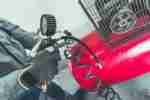 a red motorcycle parked in front of a building