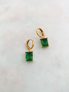 Trendy new style⚡️ Beautiful emerald green or blue gemstone on a gold huggie hoop earring. Such a glamorous color to wear this fall & winter! One pair per purchase. Limited quantity available. Choose between emerald green or blue! NEW OPTIONS: Crystal clear or white Trendy Green Crystal Earrings For Gift, Emerald Earrings For Everyday May Birthstone, Emerald Earrings For Everyday And May Birthstone, Elegant Green Emerald Hoop Earrings, Elegant Green Hoop Earrings For May Birthstone, Green Gemstone Dangle Hoop Earrings, Everyday Green Emerald Earrings, Trendy Green Dangle Hoop Earrings, Green Hoop Earrings For May Birthstone