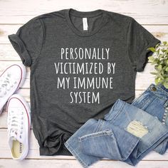 personally victimized by my immune system shirt, autoimmune disease shirt, autoimmune disease awareness, autoimmune shirt, funny women's tee UNISEX T-SHIRTS Short sleeve Unisex T-shirt - 100% combed and ring-spun cotton (fiber content may vary for different colors) - Light fabric - Tear away label - Runs true to size SIZING AND COLORS - Please refer to size chart on the listing photos in every listing for a detailed sizing chart with measurements. - We use soft and fitted unisex T-shirts from Bella Canvas that are in standard men's sizes.  - Women will typically need to order one size down SHIPPING AND PRODUCTION TIME - Production: 1-3 days - Standard Shipping: 3-5 business days after production time HOW TO ORDER - Choose your shirt color - Choose your size - Verify all order information i Itp Awareness, Funny Tees Women, Disney Bound Outfits, Mom Tees, Diy Shirt, Sizing Chart