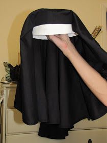 a woman in a nun outfit is holding her head over the back of a chair