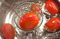 tomatoes are being cooked in a pot with water