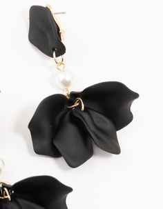 Embrace the dark side with these chic Coated Pearl Floral Drop Earrings. The bold black tones and delicate floral motif create a striking contrast, perfect for adding a touch of edgy elegance to any look. Color: Black Dimensions: Length 70 mm x Width 30 mm | Lovisa Black Coated Pearl Floral Drop Earrings Chic Black Earrings For Party, Chic Black Evening Earrings, Trendy Black Flower-shaped Jewelry, Matte Black Elegant Jewelry For Formal Occasions, Elegant Adjustable Matte Black Jewelry, Chic Black Flower Jewelry, Elegant Matte Black Adjustable Jewelry, Elegant Matte Black Jewelry For Formal Occasions, Elegant Black Flower Drop Earrings