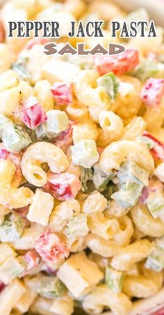 a bowl filled with macaroni salad on top of a table