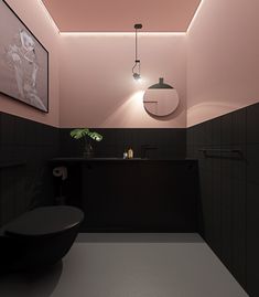 a bathroom with black and pink walls, white flooring and a round mirror on the wall