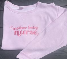 Size medium sweatshirt, embroidered to say "mother baby nurse". Embroidered on a pink sweatshirt with hot pink thread. Please message with any questions or requests. Thank you for looking! Mental Health Nursing, Mother Baby Nurse, Nursing Baby, Nurse Sweatshirt, Nursing Clothes, Pink Sweatshirt, Mother And Baby, Hot Pink, Embroidery Designs