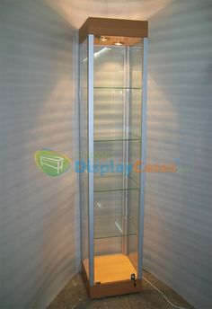 an empty display case in the corner of a room