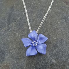 Periwinkle flower hand enamelled silver plated pendant. Designed by us, at our London office. Presented on a gift card (as shown). Our beautiful pendant embodies nature with its intricate design and attention to detail. The pendant is on a 41cm chain, with 7.5cm extension chain and lobster clasp. Matching brooch and earring available. The periwinkle flower represents purity, strength, achieving your dreams and makes a special gift. This is just one design from a range of classic flower jewellery Periwinkle Flower, Purple Wedding Inspiration, Periwinkle Flowers, Bouquet Jewelry, London Office, Jewelry Safe, Flower Pendant Necklace, Periwinkle Blue, Fantasy Jewelry