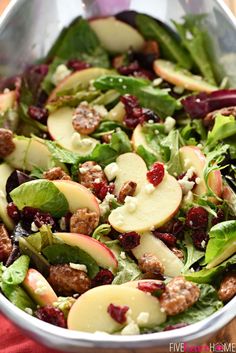 a salad with apples and cranberries in it