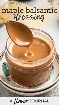 a spoon is being used to dip chocolate into a jar with the words maple balsamic dressing on it