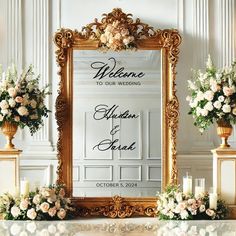 an ornate gold framed mirror with flowers and candles in front of it on a mantle