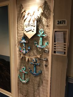 an anchor and ship's name is on the wall