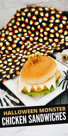 a halloween monster sandwich on a plate with the words halloween monster chicken sandwiches above it