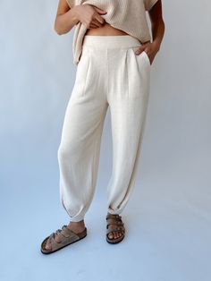 Introducing the playful and stylish Spackman Sweater Pant! Made with a cozy ivory fabric, this pant is perfect for lounging or running errands. Its unique design combines the comfort of a sweater with the convenience of pants. Stay cozy and stylish with this must-have addition to your wardrobe! (Takes loungewear to a whole new level!) Details self/lining: 100% polyester Fabric Care Guide Here Sizing & Fit Measurements are approximate and taken while laying flat across the front. Not doubled. small: bust = "; waist = "; length = " medium: bust = "; waist = "; length = " large: bust = "; waist = "; length = " Try-on Video Casual Comfortable Pants For Relaxation, Comfortable Casual Pants For Relaxation, Relaxed Fit Ankle-length Harem Pants For Loungewear, Relaxed Fit Harem Pants For Loungewear, Relaxed Ankle-length Harem Pants For Loungewear, White Wide Leg Harem Pants For Loungewear, Casual Cotton Harem Pants For Relaxation, Comfortable Spring Harem Pants For Loungewear, Beige Relaxed Fit Harem Pants For Fall