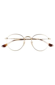 A rounded silhouette amplifies the retro-chic appeal of subtly textured metal frames styled with slim temples and an angular bridge. 50mm lens width; 21mm bridge width; 145mm temple length Prescription compatible Fitted with nonoptical demo lenses Adjustable nose pads Metal Imported Ray-Ban style number: RX3447 Frames For Round Faces, Gold Rimmed Glasses, Cute Glasses Frames, Titanium Glasses, Glasses Style, Cute Glasses, New Glasses, Metal Frames, Optical Glasses