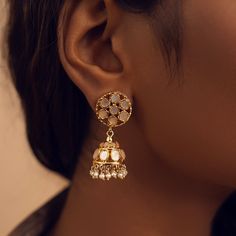 Adorn your ears with the grace of these mini pearl jhumkis. Round mother of pearls intricately arranged in captivating patterns are embraced by metal frames that elevate their elegance. The addition of delicate pearl hangings lends a touch of refinement to these jhumkis, creating a harmonious blend of sophistication and charm. Gifting: This choker set comes in a beautiful Yamoona gift box, making it an ideal gift for birthday, wedding anniversary or wedding gift. Occasion: Perfect choice for any Metal Frames, Mother Pearl, The Grace, Gold Plated Silver, Gold Material, Wedding Gift, Favorite Jewelry, Metal Frame, Ideal Gift