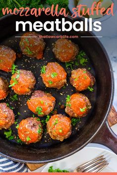 meatballs in a cast iron skillet with parsley on top and the words mozzarella stuffed meatballs above it