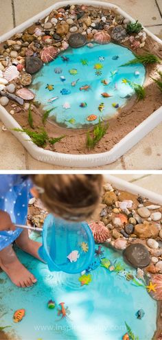 a child is playing in a sand and water play pool with rocks, pebbles and shells