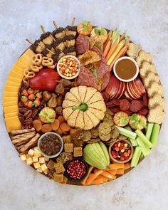 a platter filled with lots of different types of food and condiments on it