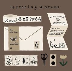 an image of a lettering and stamp set on a green background with scissors, tape, stamps, and other items