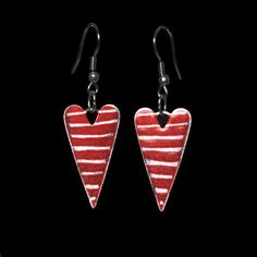 Cute red heart earrings with white stripes. The perfect statement earrings are hand-painted with attention to detail on a pristine stainless steel base. Created with a quirky and eclectic artisan design and a touch of a retro vintage feel. A beautiful gift to make someone special smile.Each item is a unique piece of art and is handmade just for you so the actual earrings might slightly differ from the pictures.Ear nuts are included♥ Care ♥ They don´t rust so you can go swimming without having to Red Heart-shaped Hand Painted Jewelry, Hand-painted Red Jewelry For Valentine's Day, Hand Painted Red Jewelry For Valentine's Day, Hand Painted White Heart Jewelry, White Hand Painted Heart Jewelry, Red Enamel Earrings For Valentine's Day, Fox Jewelry, Red Heart Earrings, Go Swimming