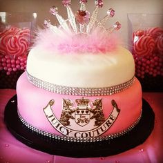 there is a cake with pink frosting and a tiara on top that says juicy county