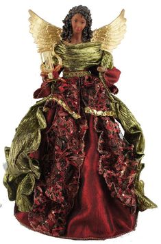 a figurine of a woman dressed in red and green