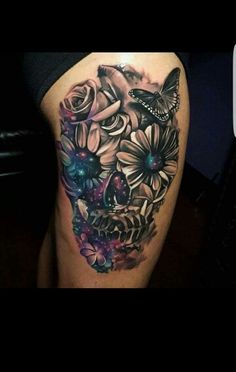 an image of a woman's thigh with flowers and butterflies tattooed on her leg