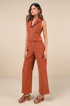 Let everyone know you're a confident cutie with the Lulus Energetic Appeal Rust Orange Corduroy Sleeveless Belted Jumpsuit! Classic corduroy fabric shapes a sleeveless bodice with a collared neckline, notched lapels, and flattering princess seams. Belt loops and a wide statement belt (with a covered buckle) accent the waist, atop wide legs with functional front and back patch pockets. Full-length hems. Exposed gold zipper at the front. Fit: This garment fits true to size. Length: Ankle length. S Sleeveless Cotton Jumpsuits For Work, Sleeveless Cotton Jumpsuits And Rompers For Work, Trendy Sleeveless Jumpsuits And Rompers For Fall, Brown Sleeveless Jumpsuit With Pockets, Sleeveless Brown Jumpsuit With Pockets, Sleeveless Brown Jumpsuits And Rompers With Pockets, Sleeveless Brown Jumpsuits For Workwear, Trendy Brown Jumpsuits And Rompers For Work, Corduroy Jumpsuit