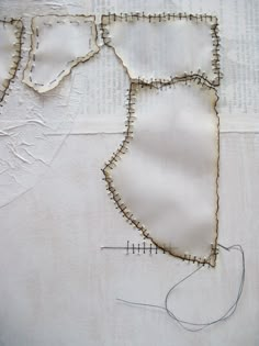 the fabric is being stitched together to make a piece of art that looks like a map