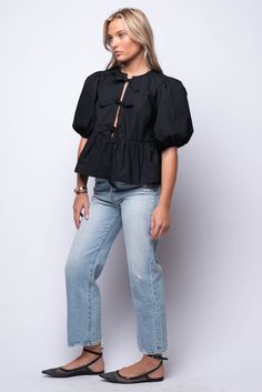 Elevate your everyday look with our Carmine Blouse. This puff sleeve blouse boasts delicate tie details on the front, adding a touch of elegance. The ruffle hem adds a feminine flair! 100% Cotton Hand Wash Cold Import Fit Guide: Hannah is 5ft 5 inches, Bust 32”, Waist 25”, Hips 29” Model is wearing a size small True to size *Available at our Envy location Casual Blouse With Puff Tie Sleeves, Chic Spring Puff Sleeve Top With Tie Sleeves, Spring Puff Sleeve Top With Tie Sleeves, Chic Blouse With Puff Tie Sleeves, Workwear Blouse With Ruffle Hem And Puff Sleeves, Spring Chic Puff Sleeve Top With Ruffle Hem, Casual Puff Sleeve Blouse With Ruffle Hem, Puff Sleeve Blouse With Ruffle Hem For Daywear, Lavender Brown