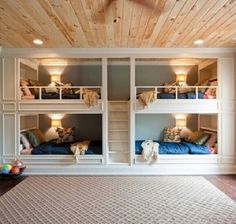 a room with bunk beds and windows in it