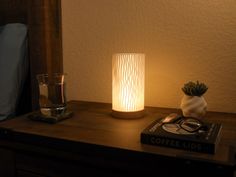 a table with a lamp and some books on it