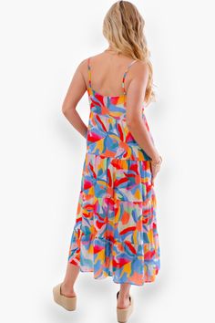 Get ready to turn heads and make a vibrant statement with the Show Me Your Mumu Rainbow Pop Caroline Maxi Dress . This eye-catching maxi dress is a true showstopper, featuring a bold and playful rainbow pop print that will instantly brighten up any room or outdoor setting. Imagine yourself twirling and swaying in this breezy, lightweight dress as you soak up the sun on a tropical getaway or attend a lively summer soiree.   Features:   The Caroline Maxi Dress boasts a flattering tiered design  Ad Multicolor A-line Maxi Dress For Beach, Multicolor Maxi Dress Beach Cover-up For Resort, Summer Multicolor Maxi Dress Beach Cover-up, Multicolor A-line Beach Maxi Dress, Floor-length Multicolor Maxi Dress With Vibrant Print, Tropical Getaways, Summer Soiree, Lightweight Dress, Show Me Your Mumu