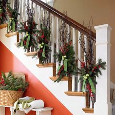 christmas decorations on the banisters and handrails are decorated with greenery