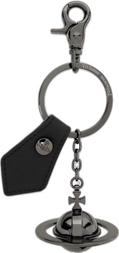 a keychain with a metal object hanging from it's side and a black tag attached to it