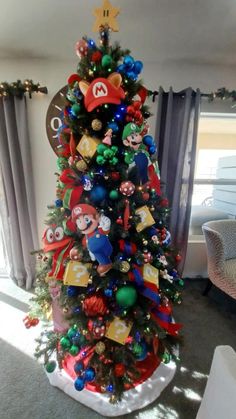 a christmas tree decorated with mario bros ornaments