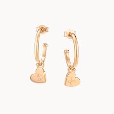 Our Personalized Heart Hoop Earrings feature delicate heart-shaped pendants that gently hang from the hoop size of your choice.18K Champagne Gold Plated or 925 Sterling SilverEarring charm size: Approx. 0.3Hoop size: Mini - 0.5 diameter. Midi - 0.7 diameter. Maxi - 1.4 diameter.Hand-engraved in our Paris workshopSent with love in a complimentary gift boxAny slight variations in lettering depth, spacing and alignment from the examples shown are part of the aesthetic and originality of the piece Yellow Gold Dangle Hoop Earrings With Heart Charm, Valentine's Day Small Hoop Heart Earrings, Personalized Gold Heart Earrings, Rose Gold Heart Charm Earrings For Everyday, Dainty Yellow Gold Huggie Earrings With Heart Charm, Small Yellow Gold Hoop Earrings With Heart Charm, Everyday Rose Gold Heart Charm Earrings, Everyday Rose Gold Heart Earrings With Charm, Anniversary Heart Charm Hoop Earrings