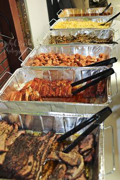 several trays filled with different types of food